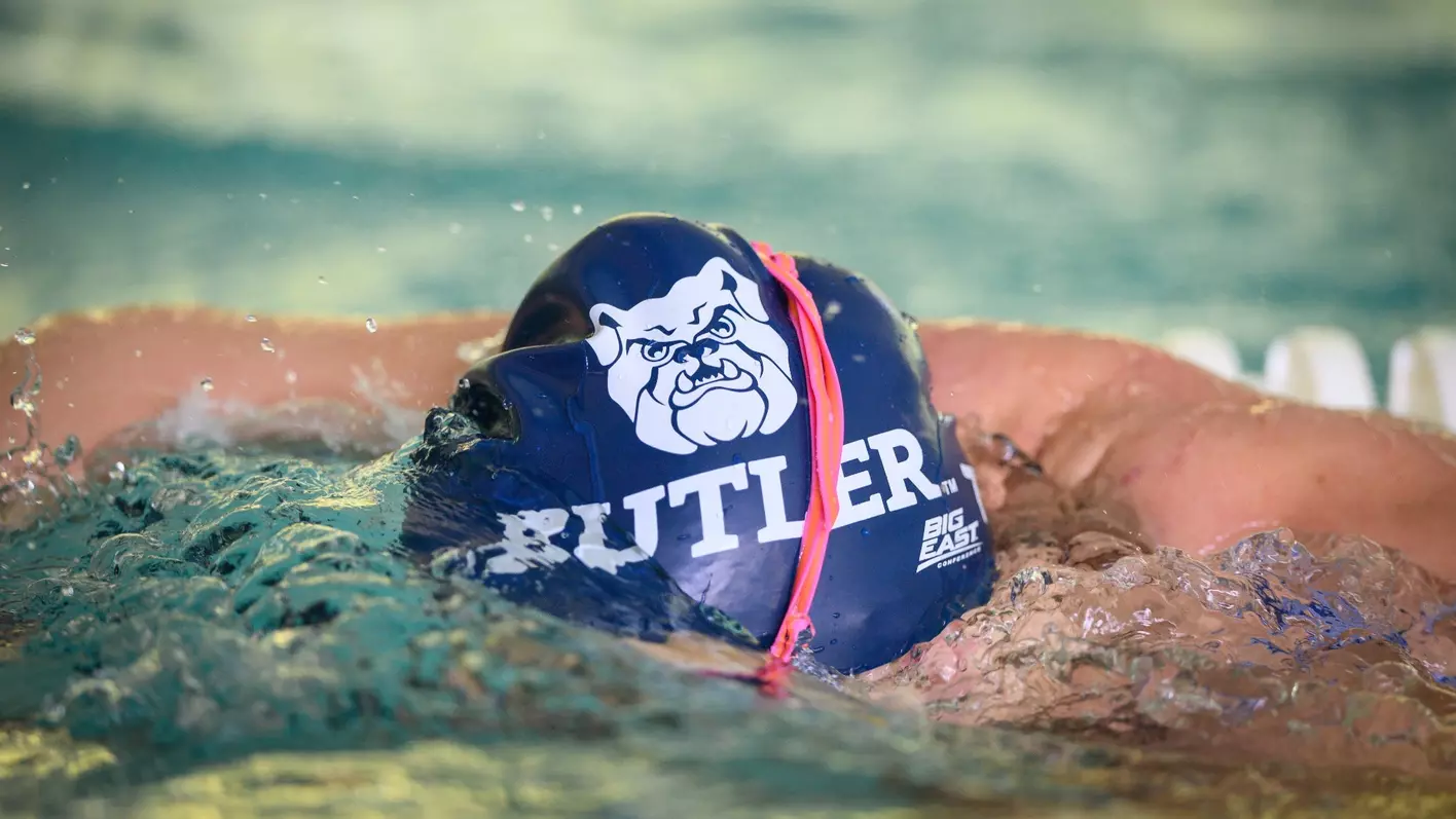 A student-athlete wearing a Butler swim cap.