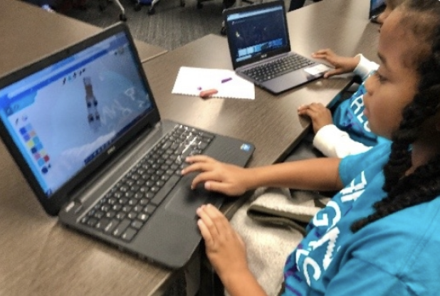 Brown Girls Code participants training on computers.