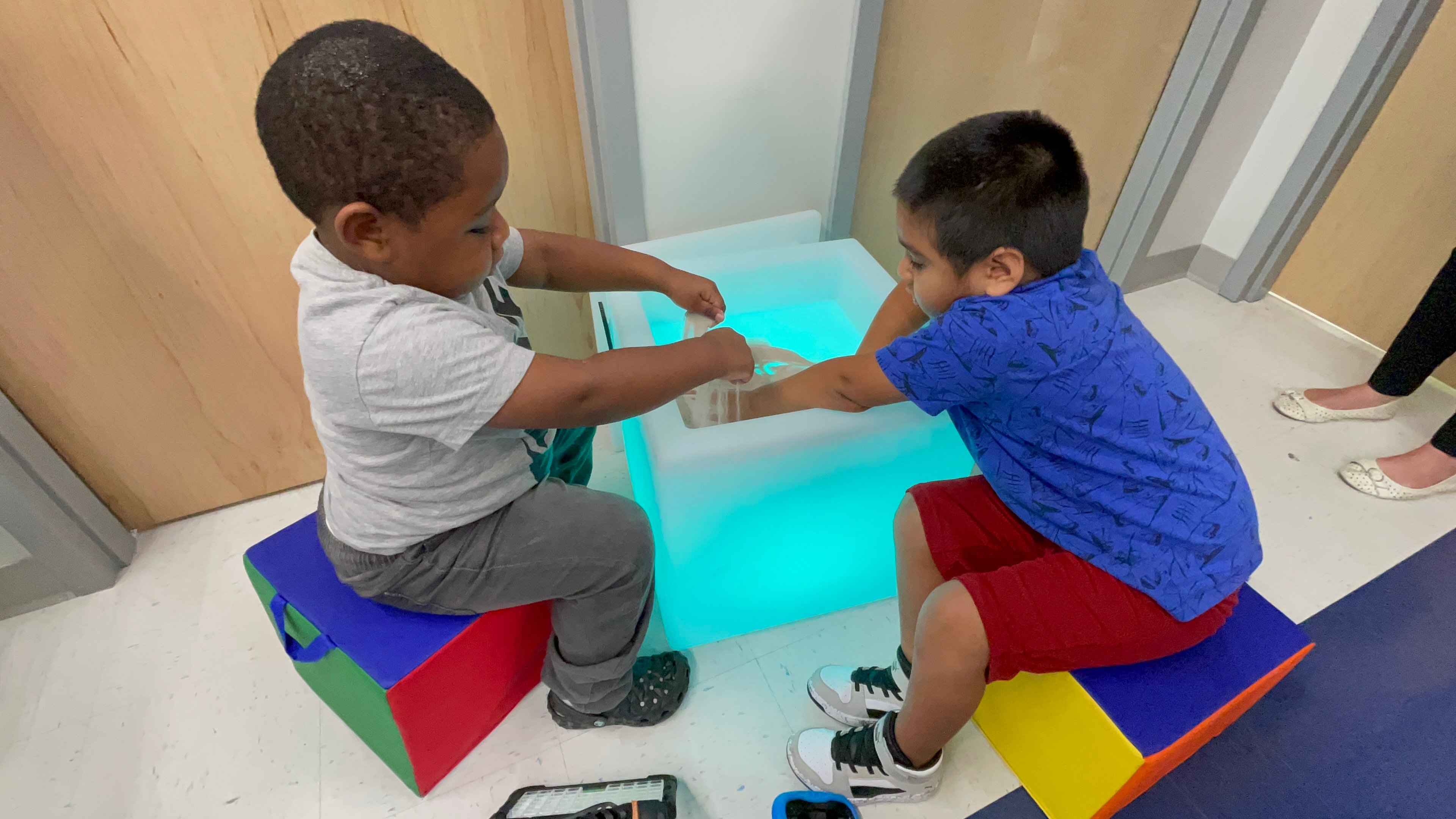 Two children playing in a sensory space