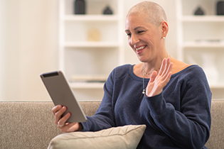 A woman using a tablet for a video call