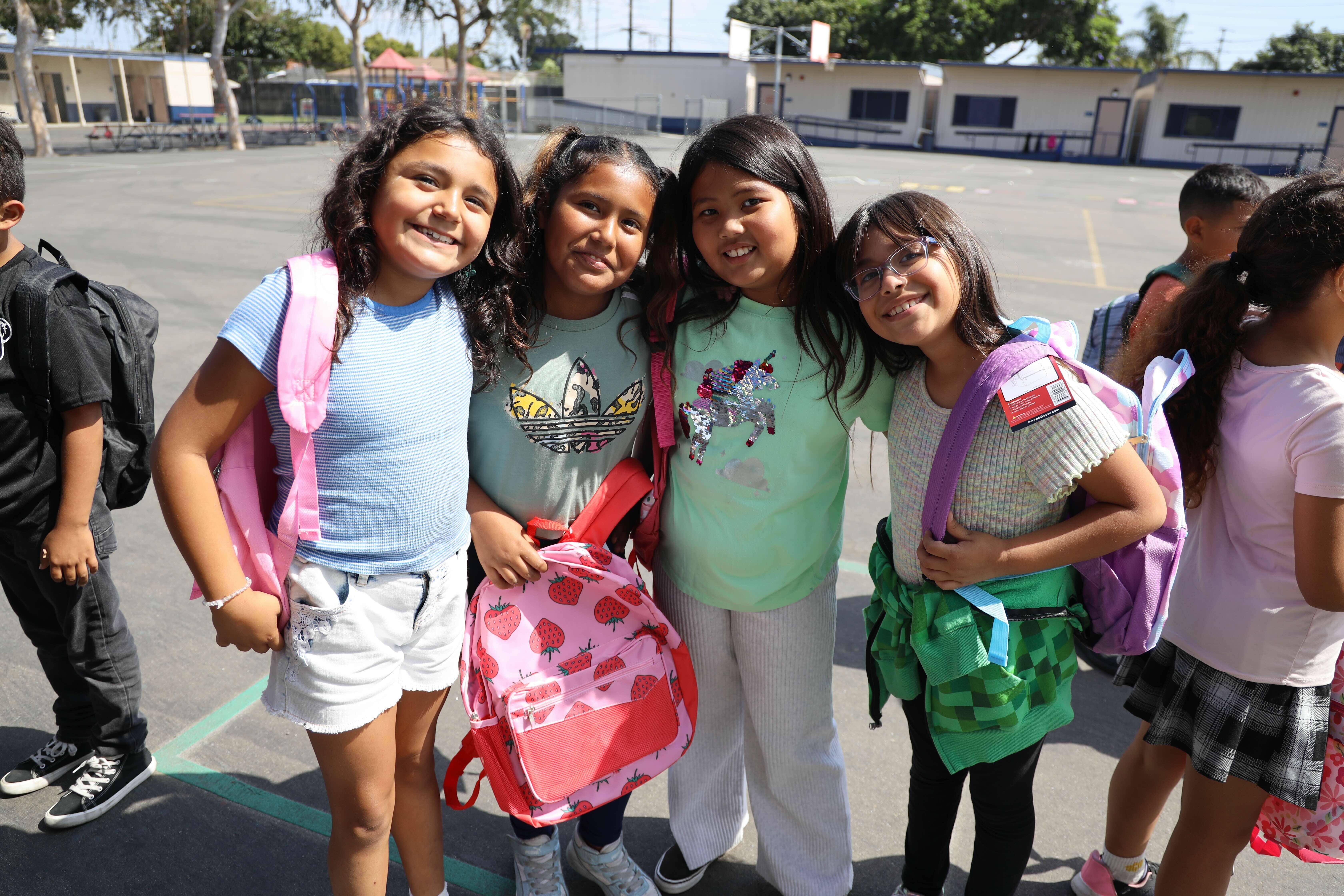 Students from Bandini Elementary at a backpack distribution.