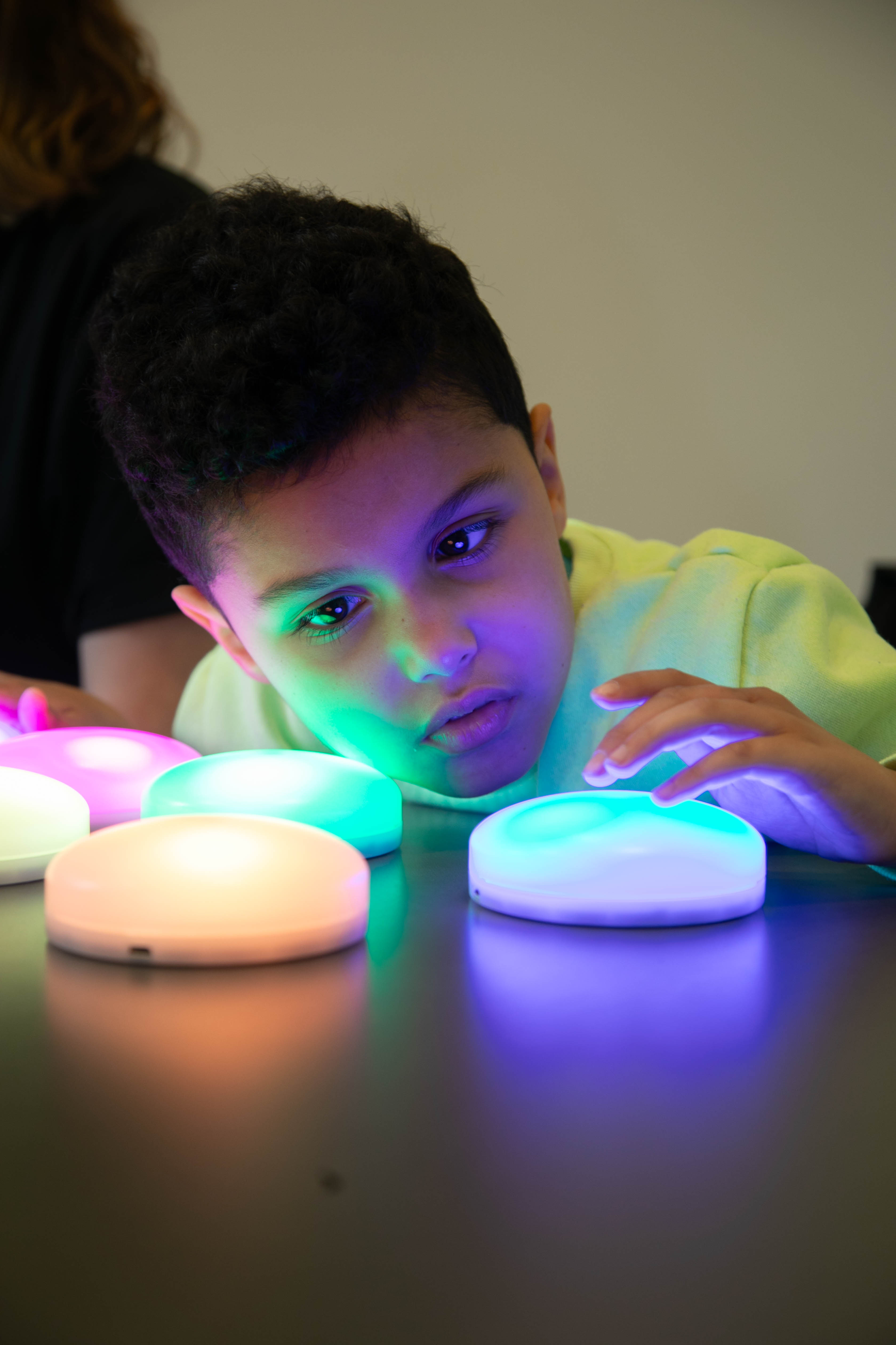 A child plays with a light-up toy