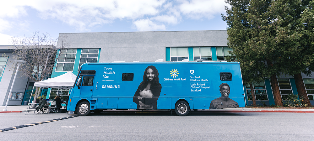 The Teen Van pictured outside of a building. 