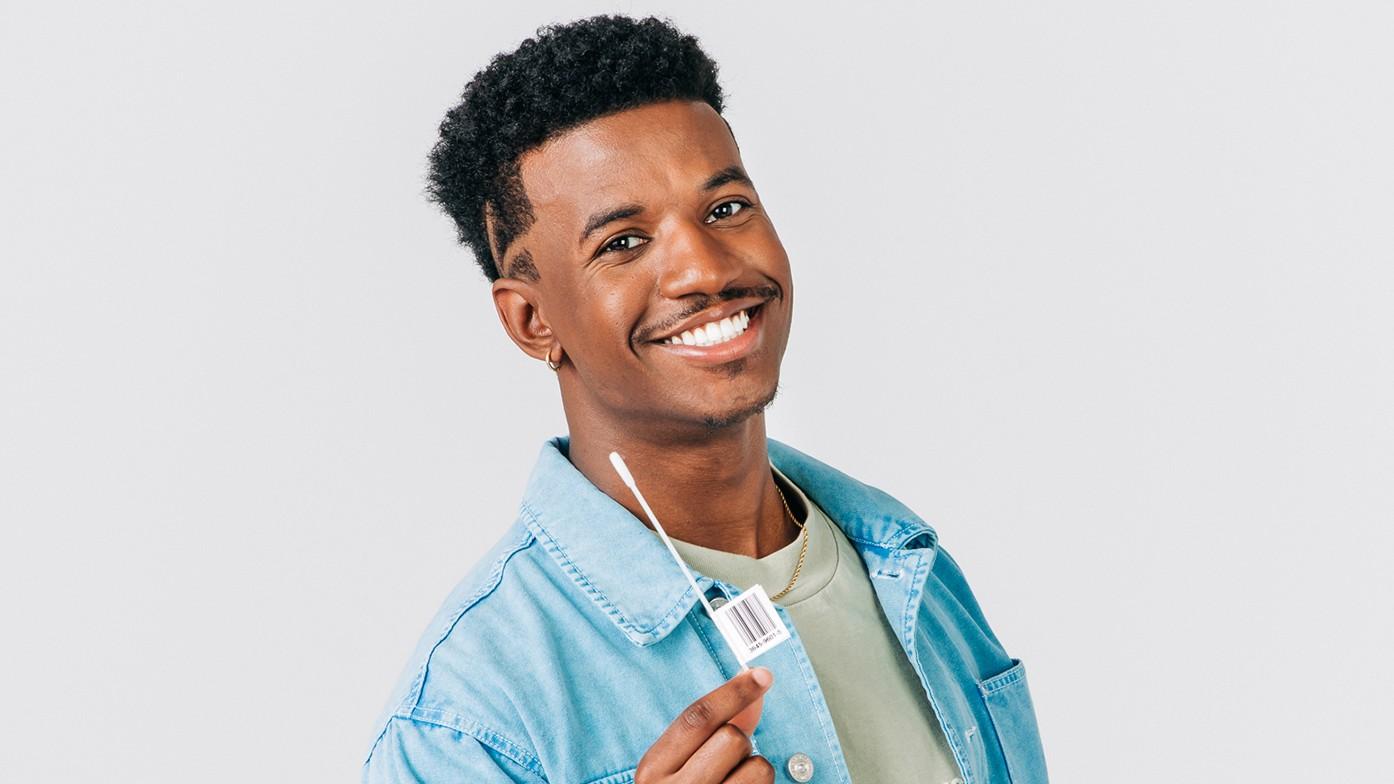 Photo of person with a swab kit.
