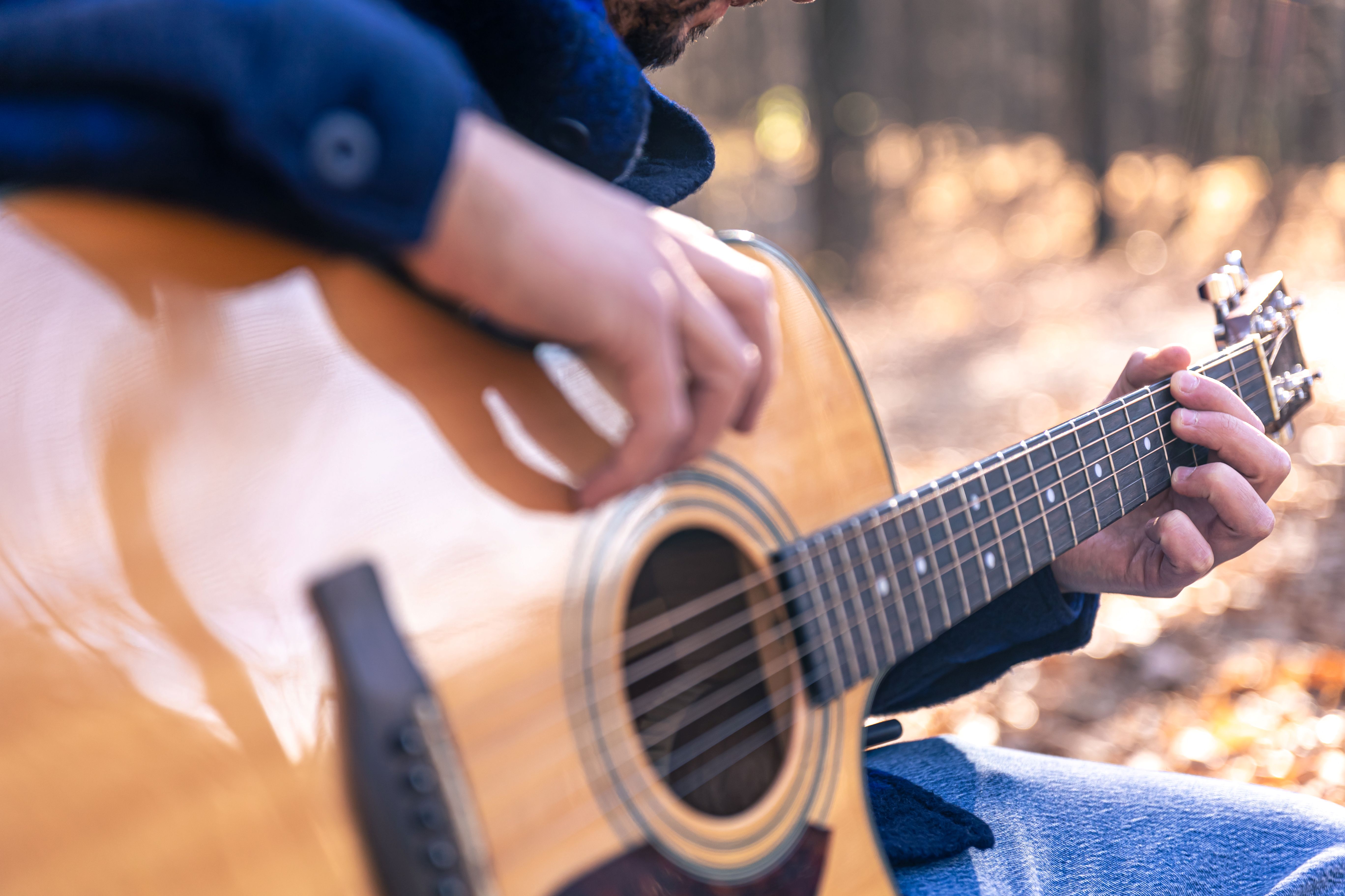 A person playing a guitar.