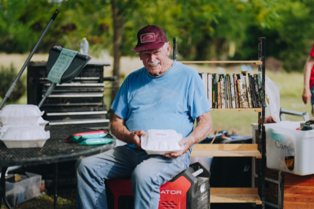 An elderly man enjoys a Mercy Chefs meal in Kerr County, TX.