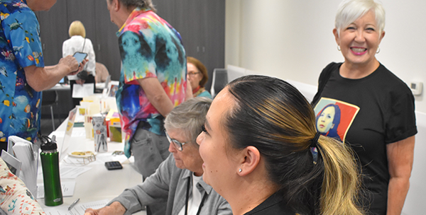 Women’s Research Institute of Nevada (WRIN) program graduates gather on a staircase.