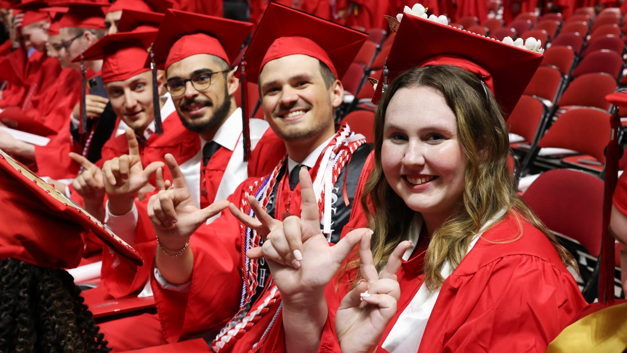 A group of smiling students at commencement.