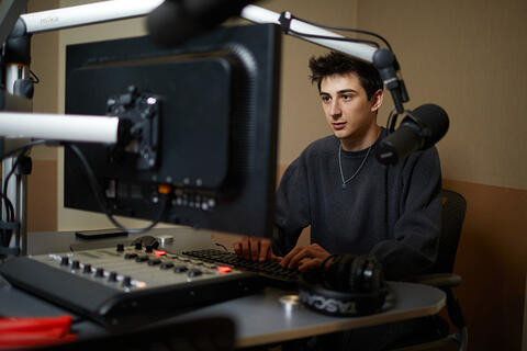 A student working at a soundboard