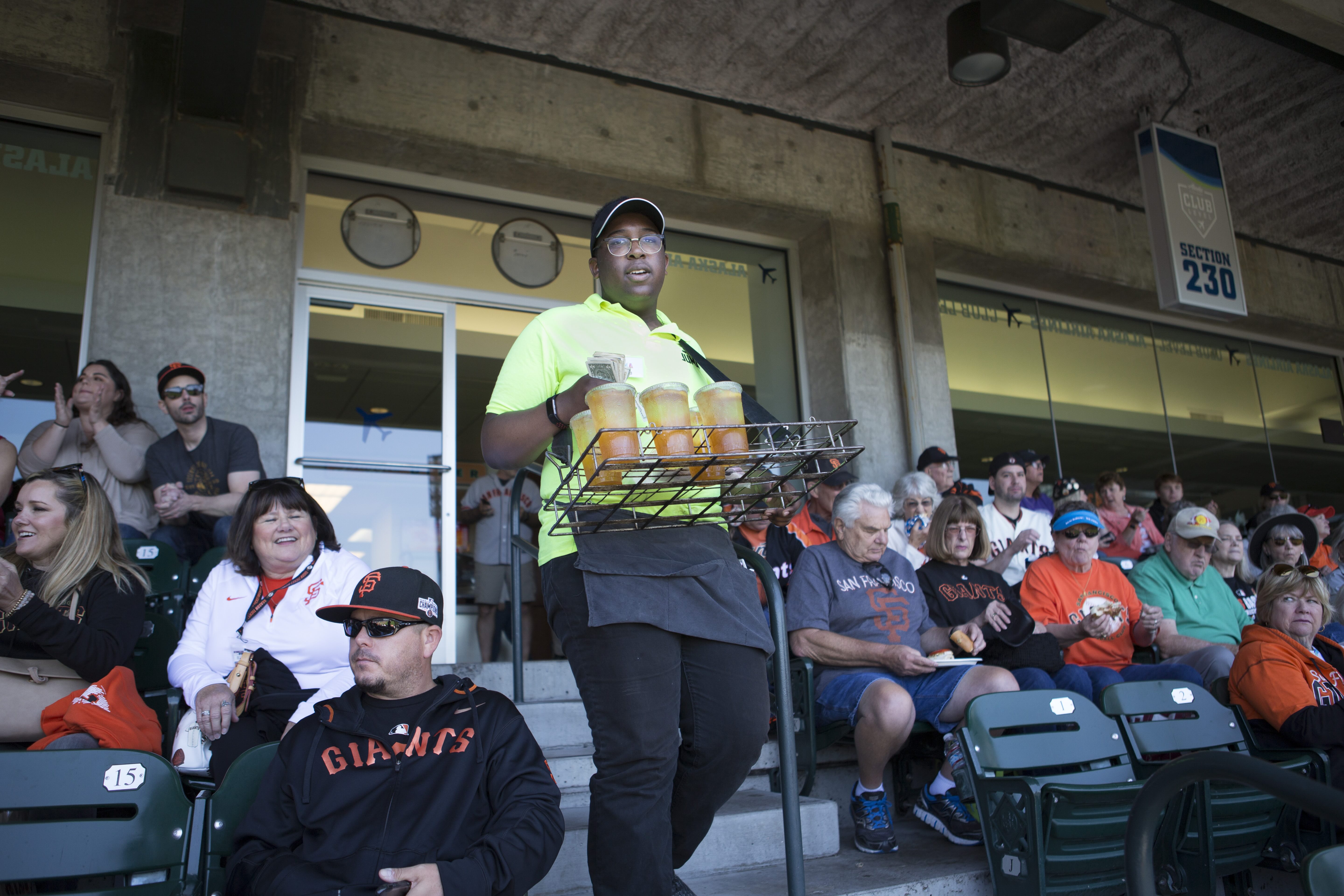 A Juma Youth sells Arnold Palmers to Giants fans on game day.