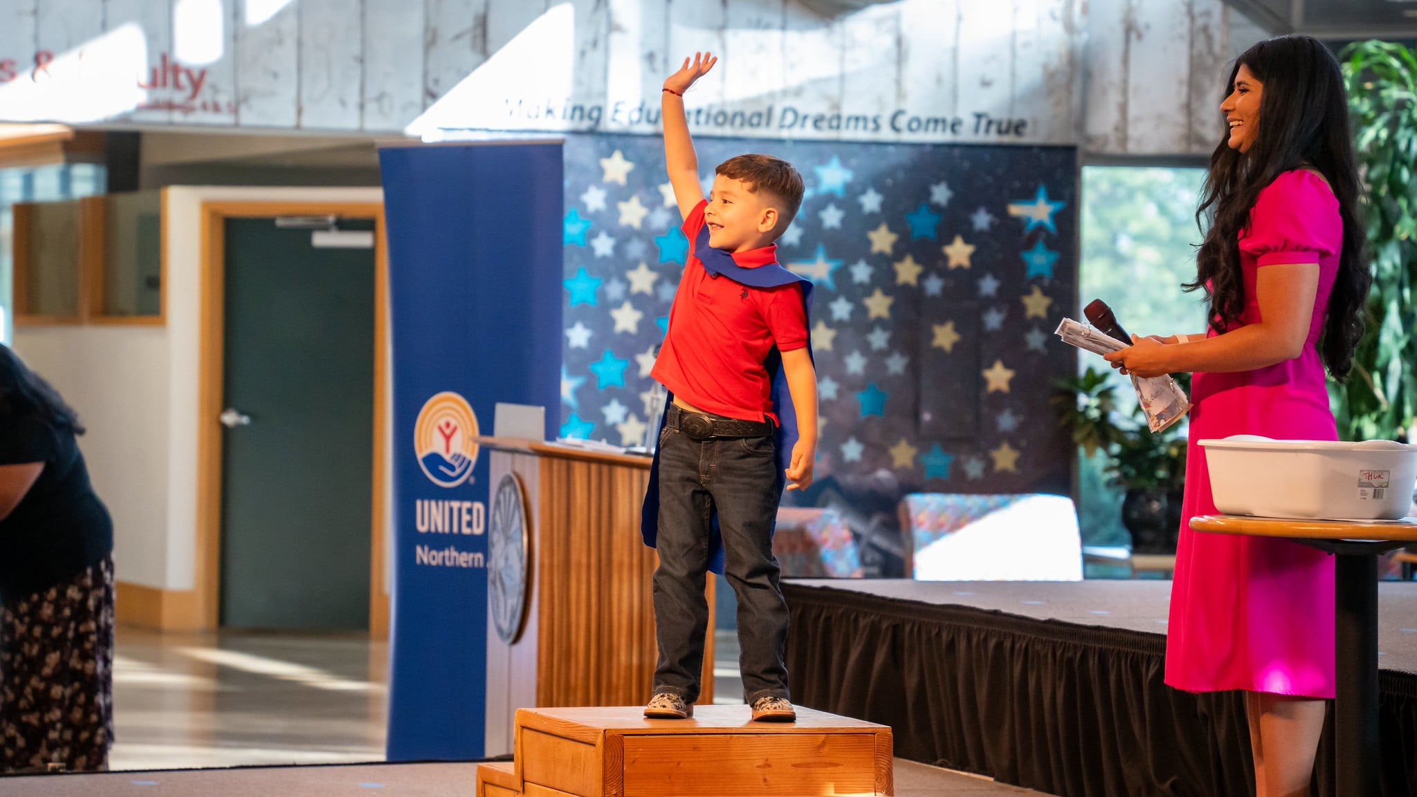 Young boy graduating from KinderCamp.