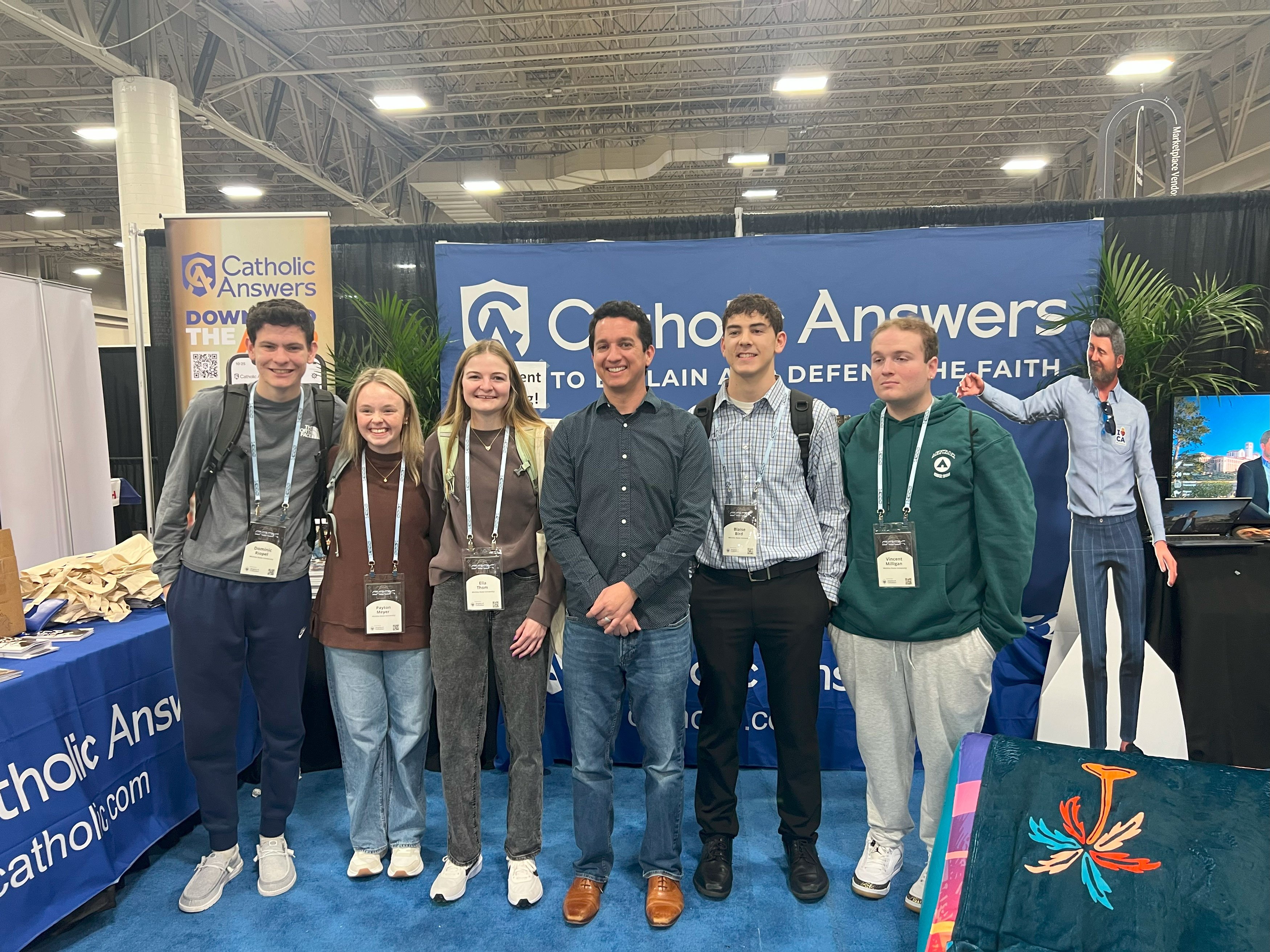 Image of Trent Horn with five young people with Catholic Answers at the SEEK conference.